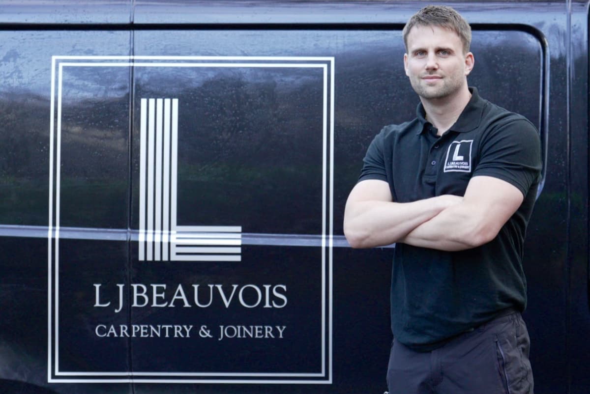Liam Beauvois with a bespoke built-in TV unit and fitted shelving