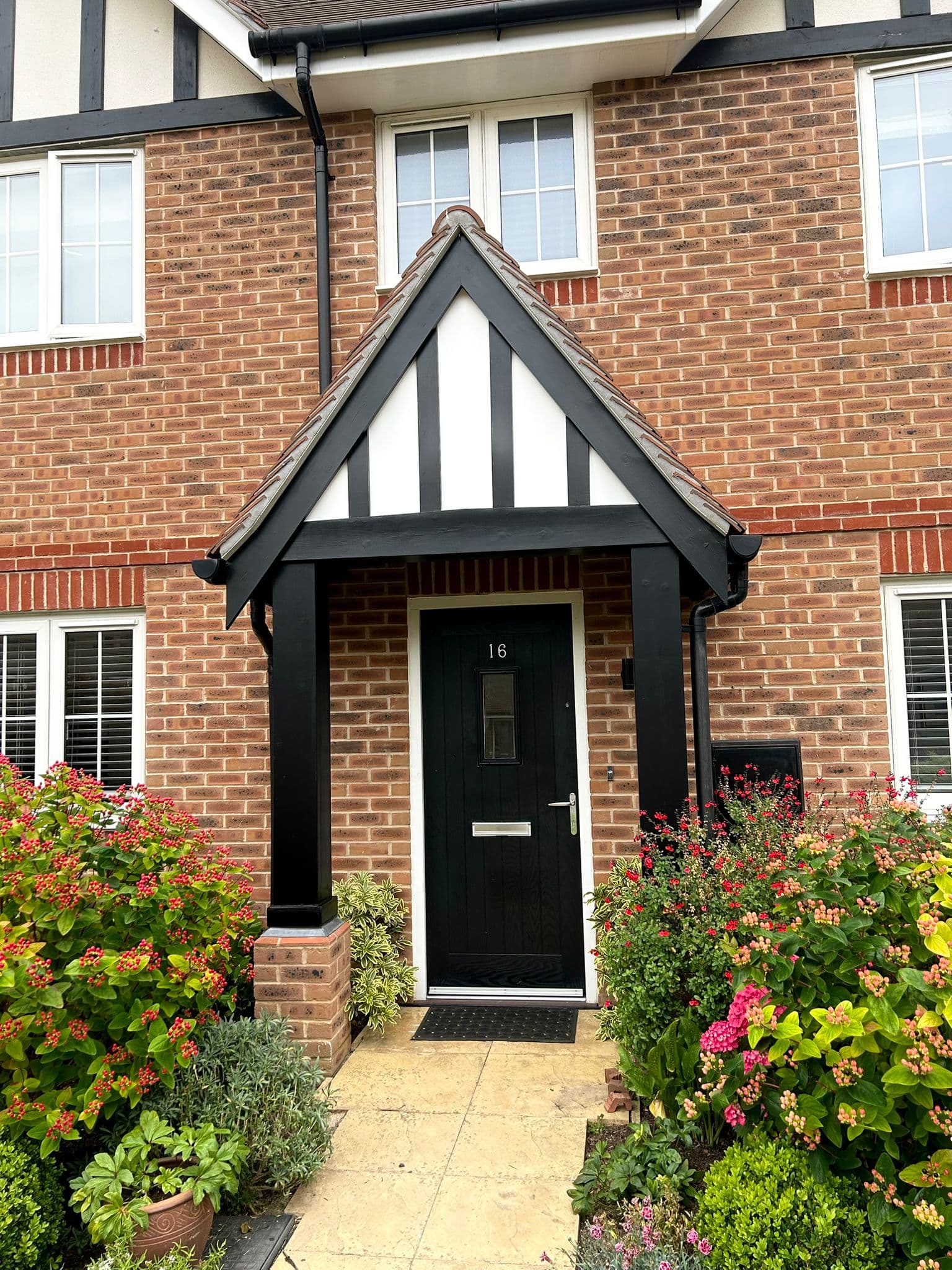 Traditional front porch with timber frame and decorative gable