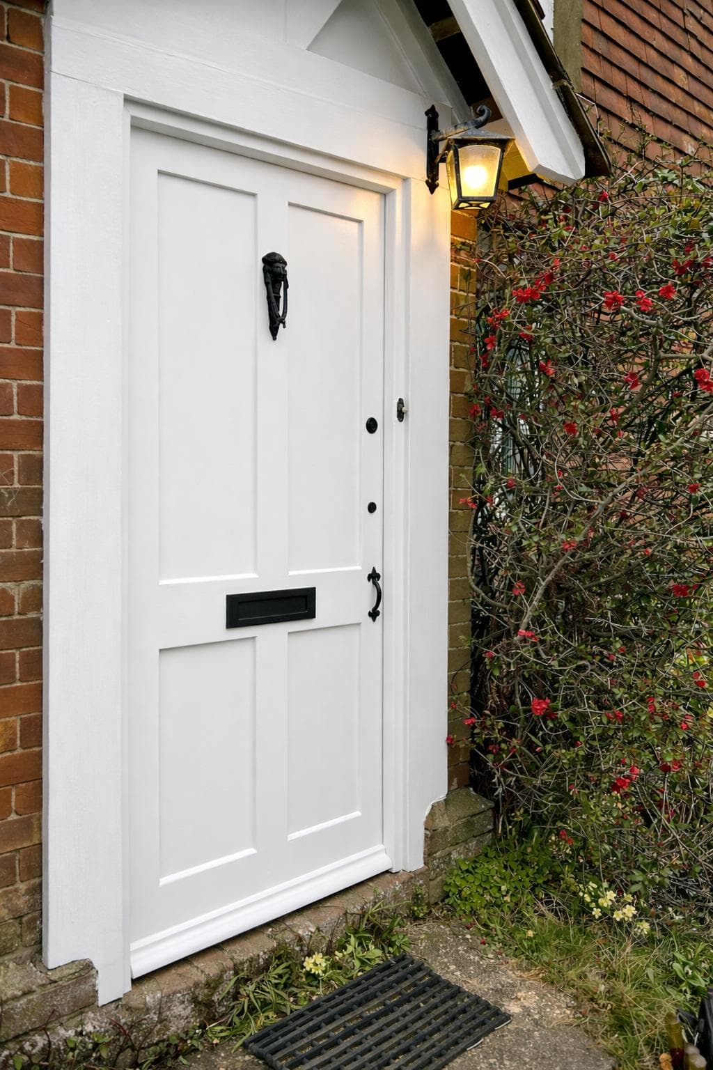 White painted timber front door with glazed panels and period detailing